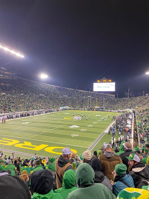 Autzen Stadium at night with GET LOUD on the scoreboard