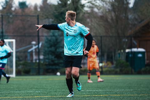 Hayden Schuster pointing across the field during a soccer match
